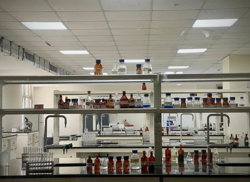 A detailed view of a modern science lab with chemical bottles and test tubes.